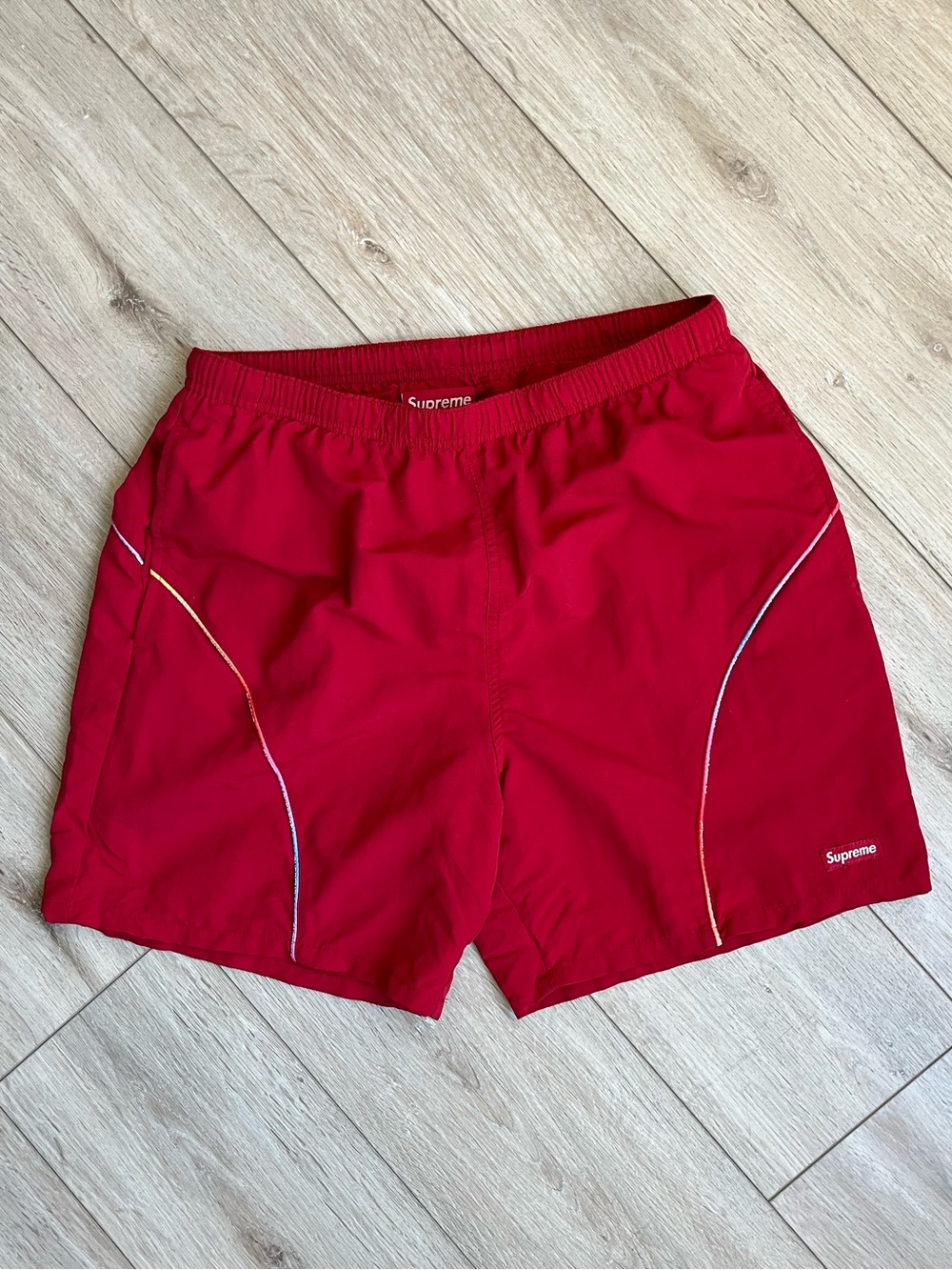Supreme Gradient Piping Water Shorts, Red